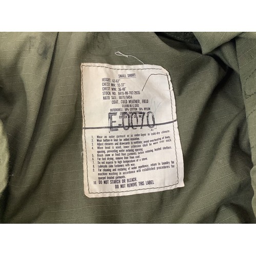 432 - A green US Airforce flight jacket with applied badges for Pacific Air Forces, Sergeant arm patch and... 
