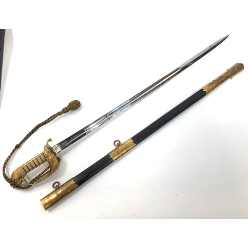 434 - An 1827 pattern Royal Naval Officers Sword with wire bound fish skin grip, lion’s head pommel, gilt ... 