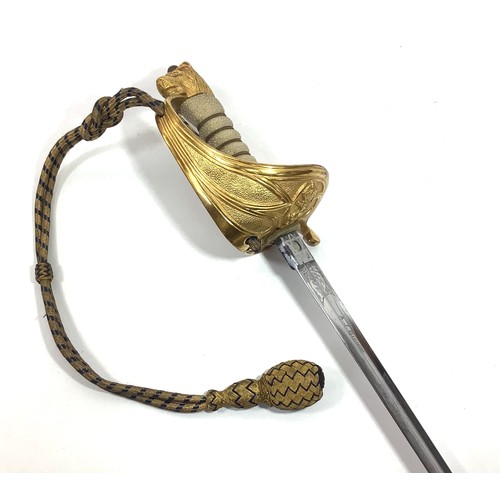 434 - An 1827 pattern Royal Naval Officers Sword with wire bound fish skin grip, lion’s head pommel, gilt ... 