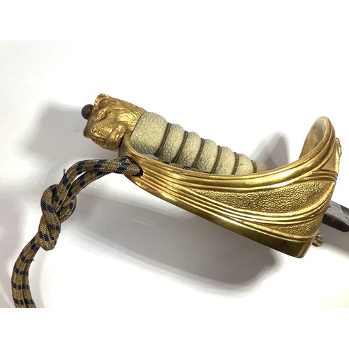 434 - An 1827 pattern Royal Naval Officers Sword with wire bound fish skin grip, lion’s head pommel, gilt ... 