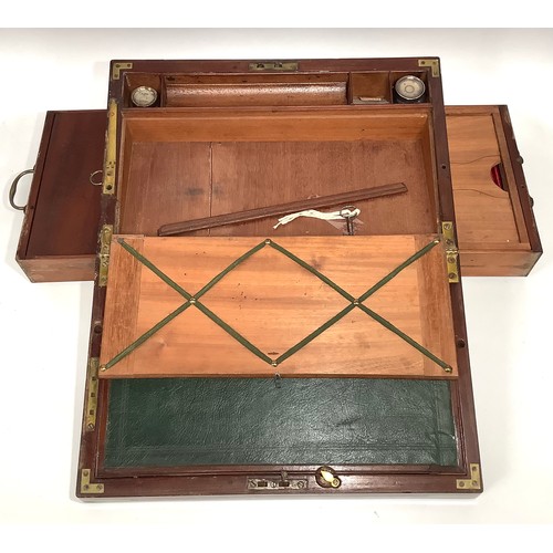 446 - A Victorian mahogany campaign folding writing slope with brass corners, twin side drawers with brass... 