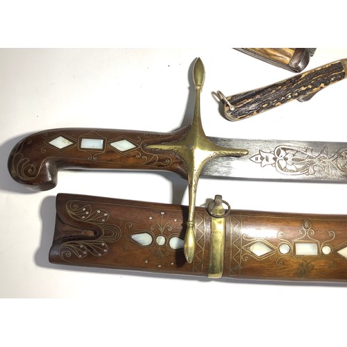 448 - Twenty one various swords and daggers including an Indo-Persian shamshir with engraved curved blade ... 