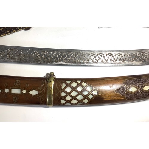 448 - Twenty one various swords and daggers including an Indo-Persian shamshir with engraved curved blade ... 