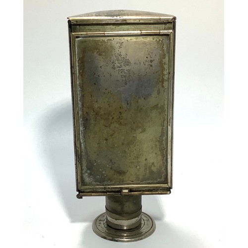 452 - A campaign travel lamp with monogrammed hinged cover, reflective panel and extendable foot, together... 