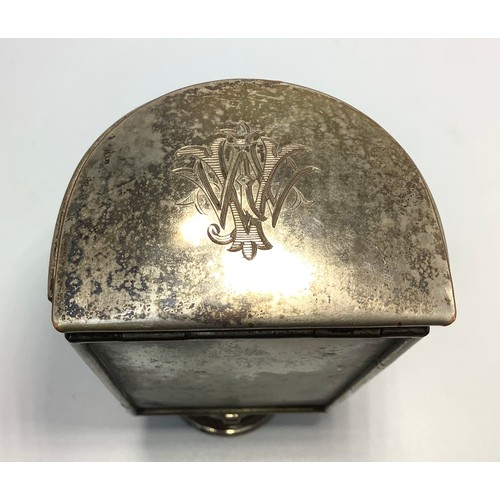 452 - A campaign travel lamp with monogrammed hinged cover, reflective panel and extendable foot, together... 