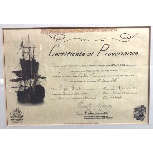 453 - A mounted, glazed and framed fragment of oak from HMS Victory with certificate of provenance signed ... 