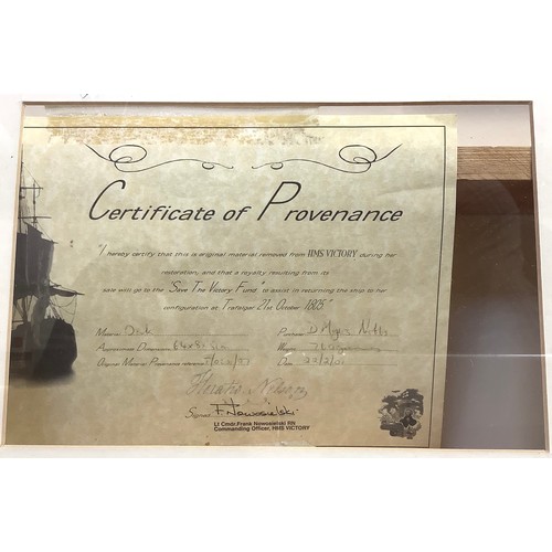 453 - A mounted, glazed and framed fragment of oak from HMS Victory with certificate of provenance signed ... 