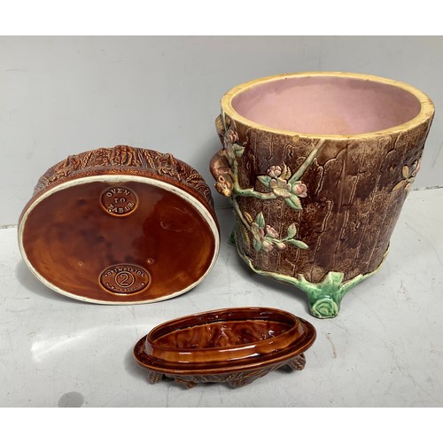 15 - A 19th century Majolica pottery jardiniere modelled as a tree-stump with vines, fruiting flowers and... 