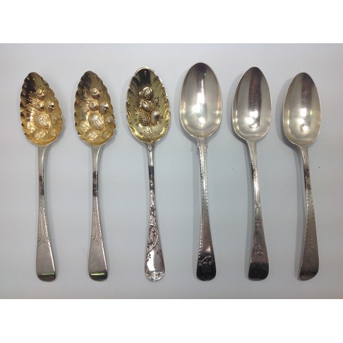 39 - A pair of George III silver and silver-gilt berry spoons, London, 1810, together with another Georgi... 