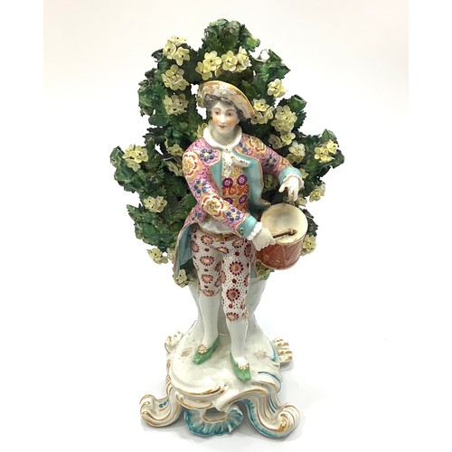 2 - A Chelsea Gold Anchor figure of a drummer boy, modelled on a rococo base against floral bocage, 'gol... 