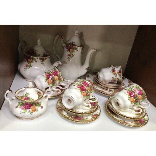 33 - A Royal Albert Old Country Roses pattern part tea and coffee service comprising teapot, coffee pot, ... 