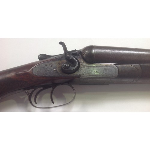 445 - A 12-bore double-barrel hammer-action shotgun by Johnson & Wright, with 29