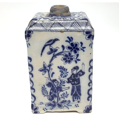 19 - An 18th century Dutch Delft pottery tea canister, painted in underglaze blue with bird and figural c... 