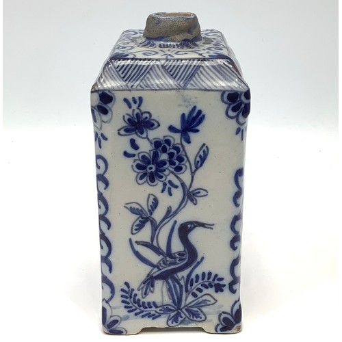 19 - An 18th century Dutch Delft pottery tea canister, painted in underglaze blue with bird and figural c... 