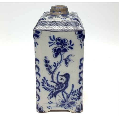 19 - An 18th century Dutch Delft pottery tea canister, painted in underglaze blue with bird and figural c... 