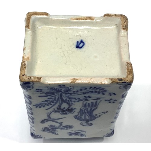 19 - An 18th century Dutch Delft pottery tea canister, painted in underglaze blue with bird and figural c... 