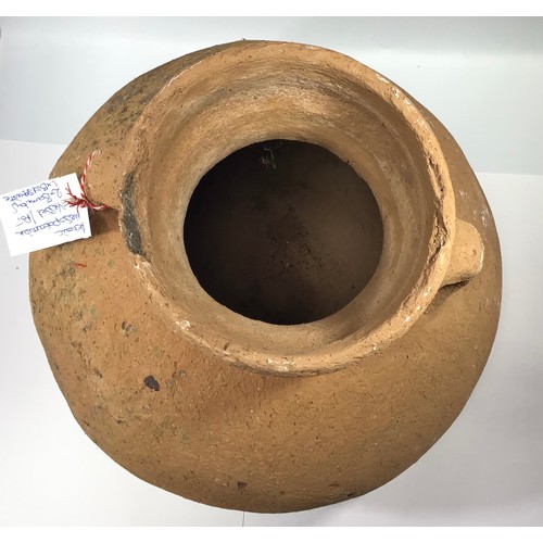 5 - A large Middle Eastern terracotta amphora style round bottomed water vessel with twin handles, appro... 