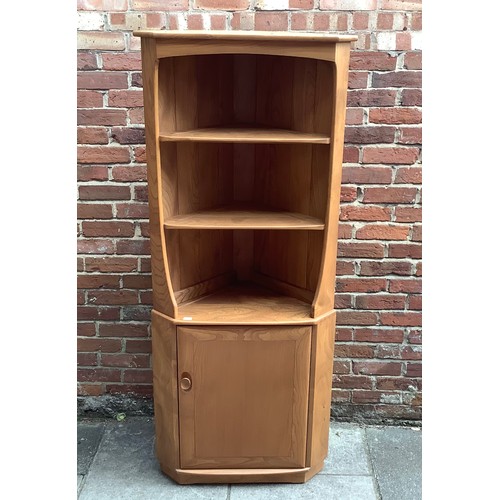 613 - An Ercol blonde elm corner cabinet, with two shelves above a single cupboard, 180 x 75cm