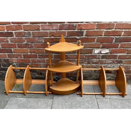 614 - Three Ercol blonde elm hanging corner shelves, together with a wall hanging set of two plate shelves... 