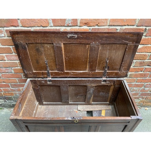 608 - An 18th Century oak three panelled coffer, on stile supports, 104cm wide