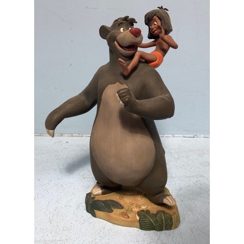 26 - A Walt Disney Classics Collection Jungle Book porcelain figure of Baloo with Mowgli on his shoulders... 