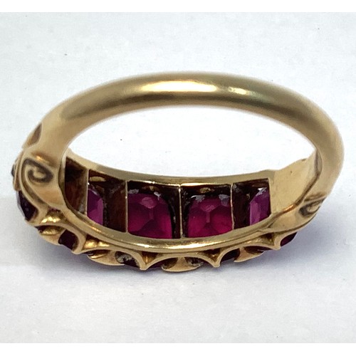 133 - A gold and garnet ring, tests as 18ct, set with five graduated garnets, the largest measuring 7x6mm,... 