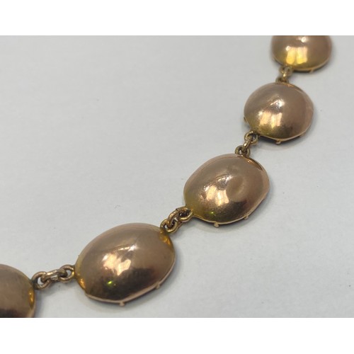 151 - A 19th century Georgian yellow metal (tests as 14ct) garnet 'coloured' paste stone rivière necklace ... 