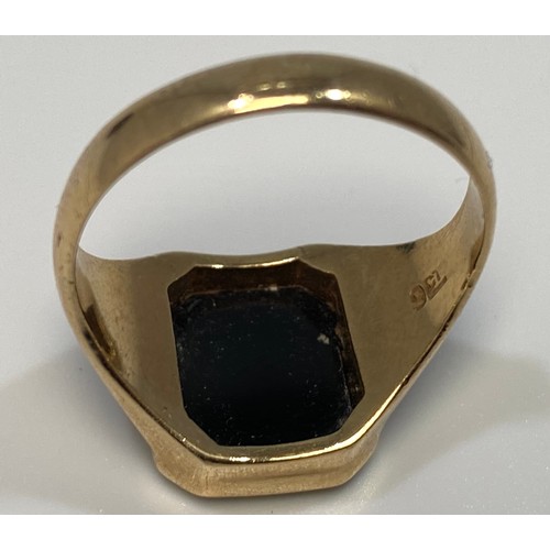 183 - A yellow metal (marked 9ct) signet ring, with black onyx top with masonic symbol in gold, weighs 5.1... 