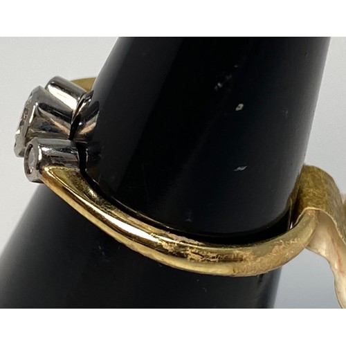 178 - An 18ct yellow gold diamond ring, set with three round brilliant cut diamonds in a rub-over bezel se... 