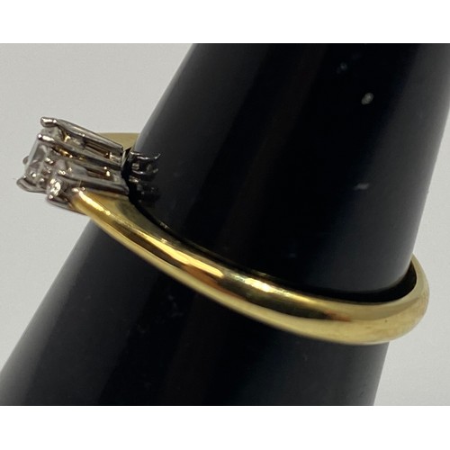 177 - An 18ct yellow gold three stone diamond ring, all round brilliant cut diamonds being G in colour, VS... 