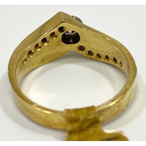 161 - An 18ct gold diamond ring, set with a round brilliant cut diamond to the centre, and six smaller dia... 