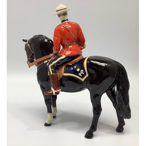 46 - A Beswick pottery figure, Canadian Mountie, model no. 1375, designed by Arthur Gredington, 21cm tall