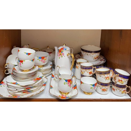 34 - A Carlton China tea and coffee service decorated with flowers to a white ground, comprising coffee p... 