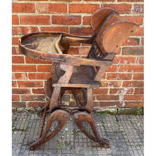 611 - A metamorphic child’s high / low chair with brown leather back and sides with studded detail, togeth... 