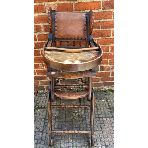 611 - A metamorphic child’s high / low chair with brown leather back and sides with studded detail, togeth... 