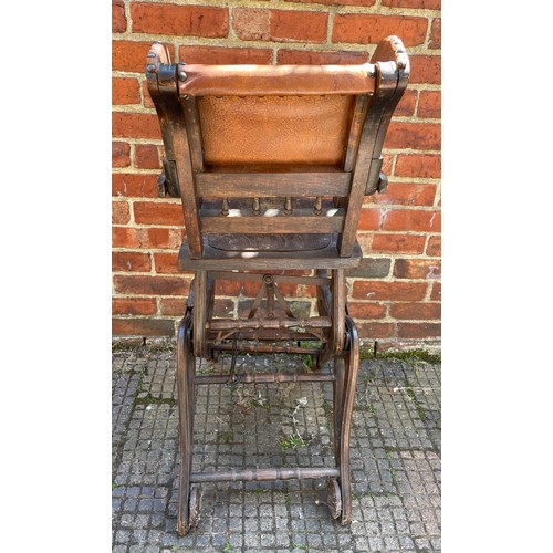 611 - A metamorphic child’s high / low chair with brown leather back and sides with studded detail, togeth... 