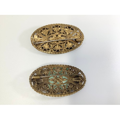 139 - Two 1930s gilt metal Chinese style shaped oval brooches probably by Max Neiger (brothers), one with ... 