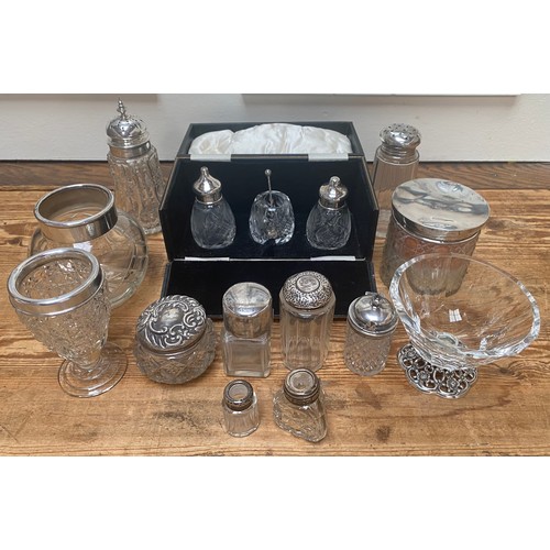 80 - A collection of assorted silver topped toilette jars including a cased three-piece cruet set by Syny... 