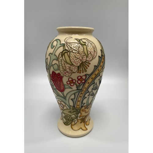 30 - A Moorcroft pottery vase in the Golden Lily pattern to ivory ground, designed by Sally Tuffin, of in... 