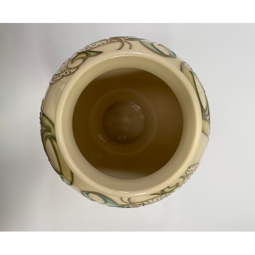 30 - A Moorcroft pottery vase in the Golden Lily pattern to ivory ground, designed by Sally Tuffin, of in... 