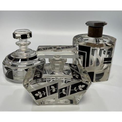 98A - Three various Art Deco glass perfume bottles all with black geometric designs, the tallest 13cm (two... 