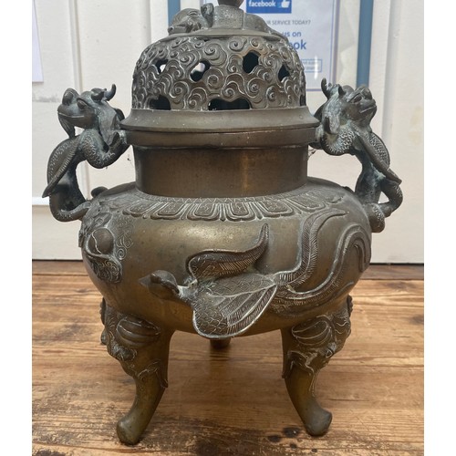 107 - A Chinese copper alloy censor, cast and chased with elephant finial to the pierced dome cover, drago... 