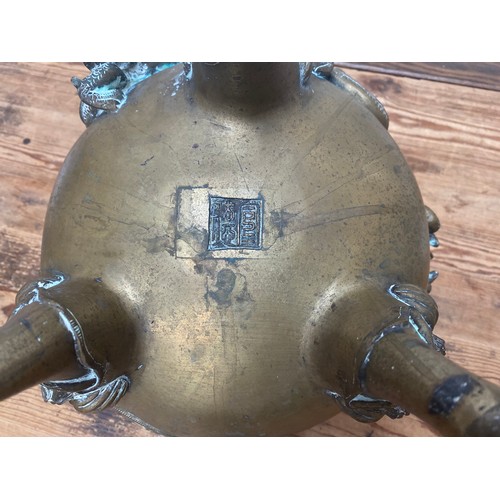 107 - A Chinese copper alloy censor, cast and chased with elephant finial to the pierced dome cover, drago... 