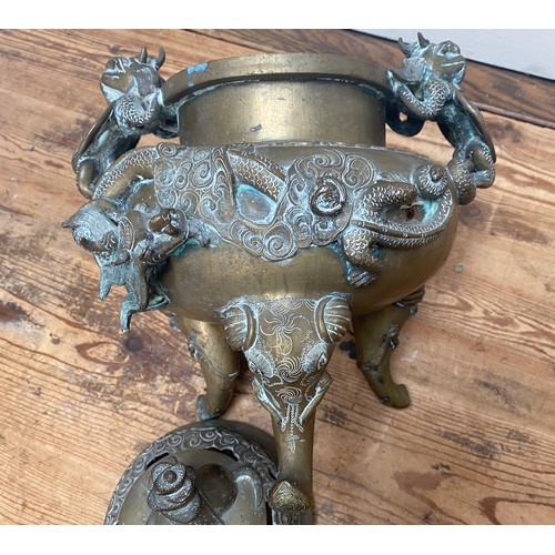 107 - A Chinese copper alloy censor, cast and chased with elephant finial to the pierced dome cover, drago... 