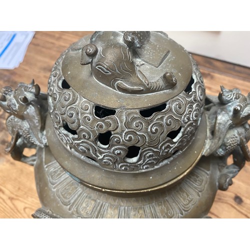 107 - A Chinese copper alloy censor, cast and chased with elephant finial to the pierced dome cover, drago... 