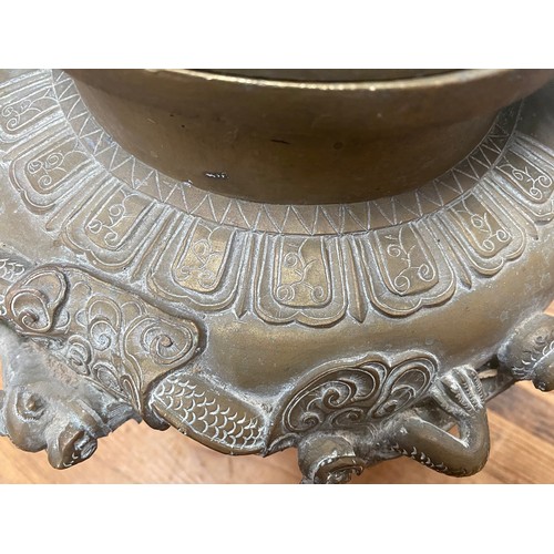 107 - A Chinese copper alloy censor, cast and chased with elephant finial to the pierced dome cover, drago... 