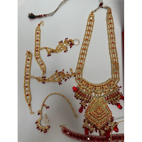 211 - An Indian 22ct gold-plated demi-parure jewellery set, with red and white stones, in retailers box, t... 