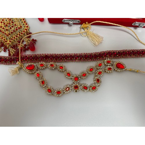 211 - An Indian 22ct gold-plated demi-parure jewellery set, with red and white stones, in retailers box, t... 