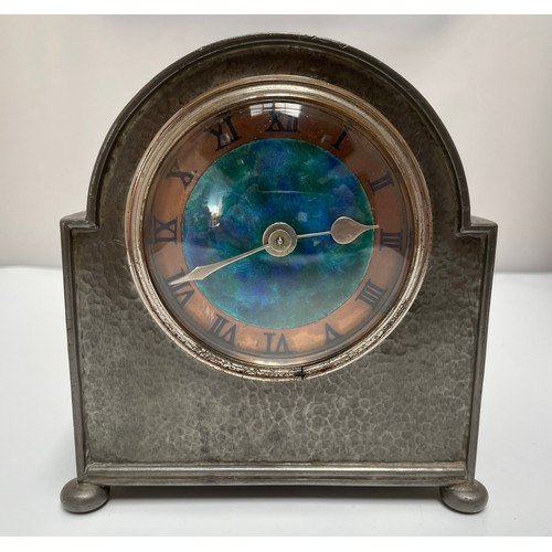 454 - An Archibald Knox (1864-1933) for Liberty & Co ‘Tudric’ pewter mantel clock, with arched top, copper... 