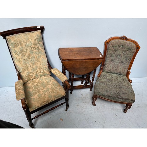 557 - A Victorian upholstered chair with carved and fluted front supports, together with a parlour chair w... 